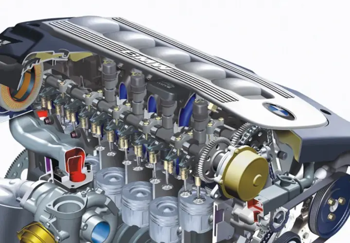 Przekrój silnika BMW M57N2 z widocznymi turbosprężarkami, tłokami i zaworami.