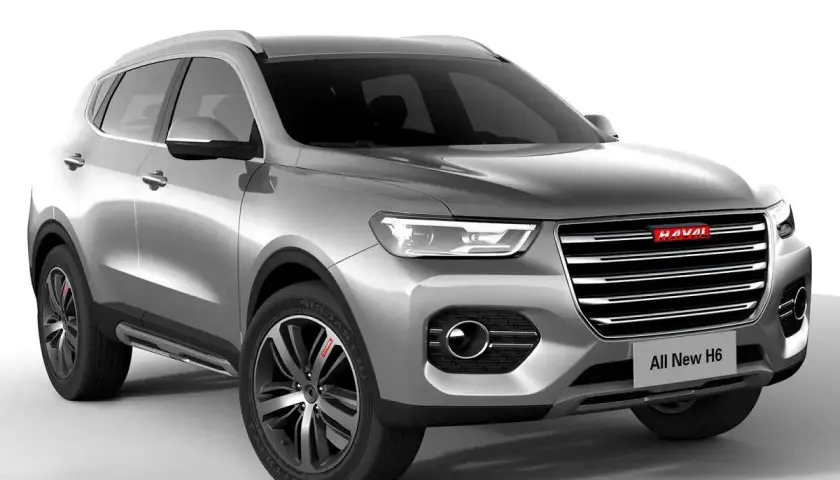 Srebrny SUV Haval H6 z czerwonym logo. Nowoczesny design, eleganckie linie i sportowe felgi.