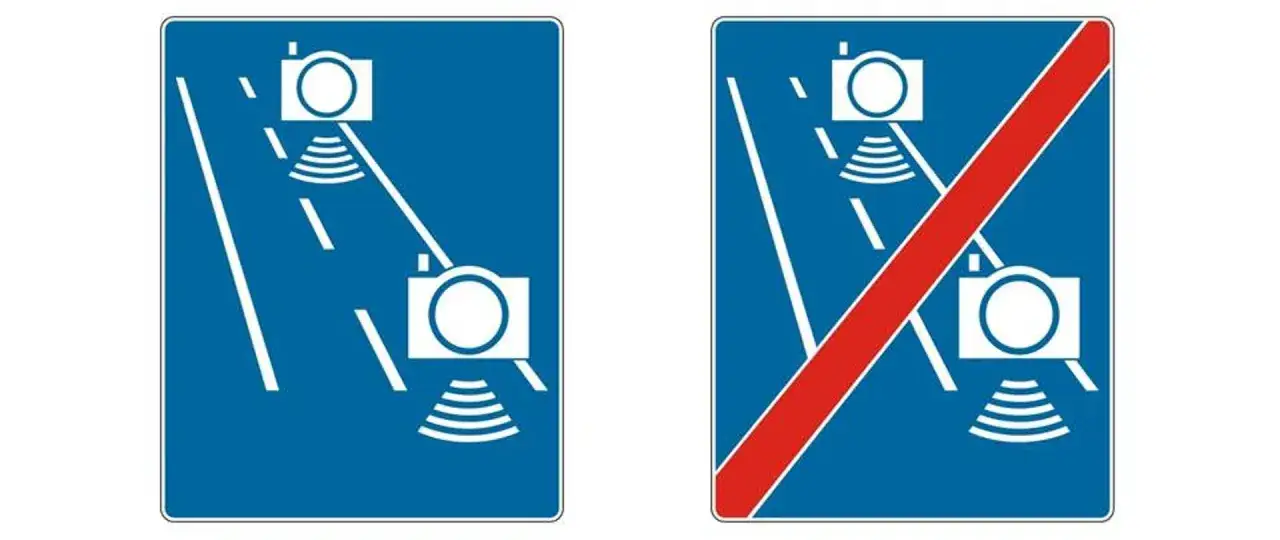 Znaki drogowe informujące o odcinkowym pomiarze prędkości. Jeden znak pokazuje początek, drugi koniec.