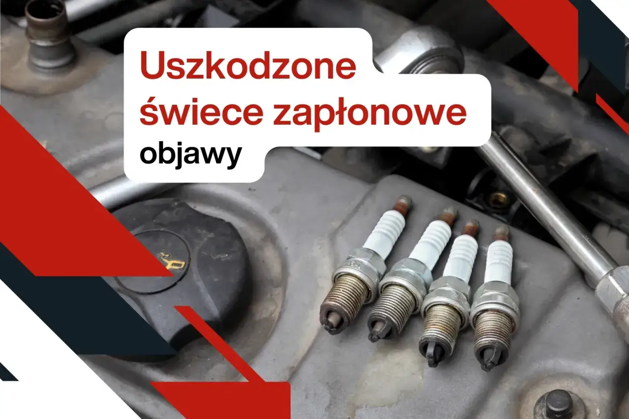 Cztery zużyte świece zapłonowe leżą na silniku. Dowiedz się, kiedy wymiana świec zapłonowych jest konieczna, aby uniknąć problemów.