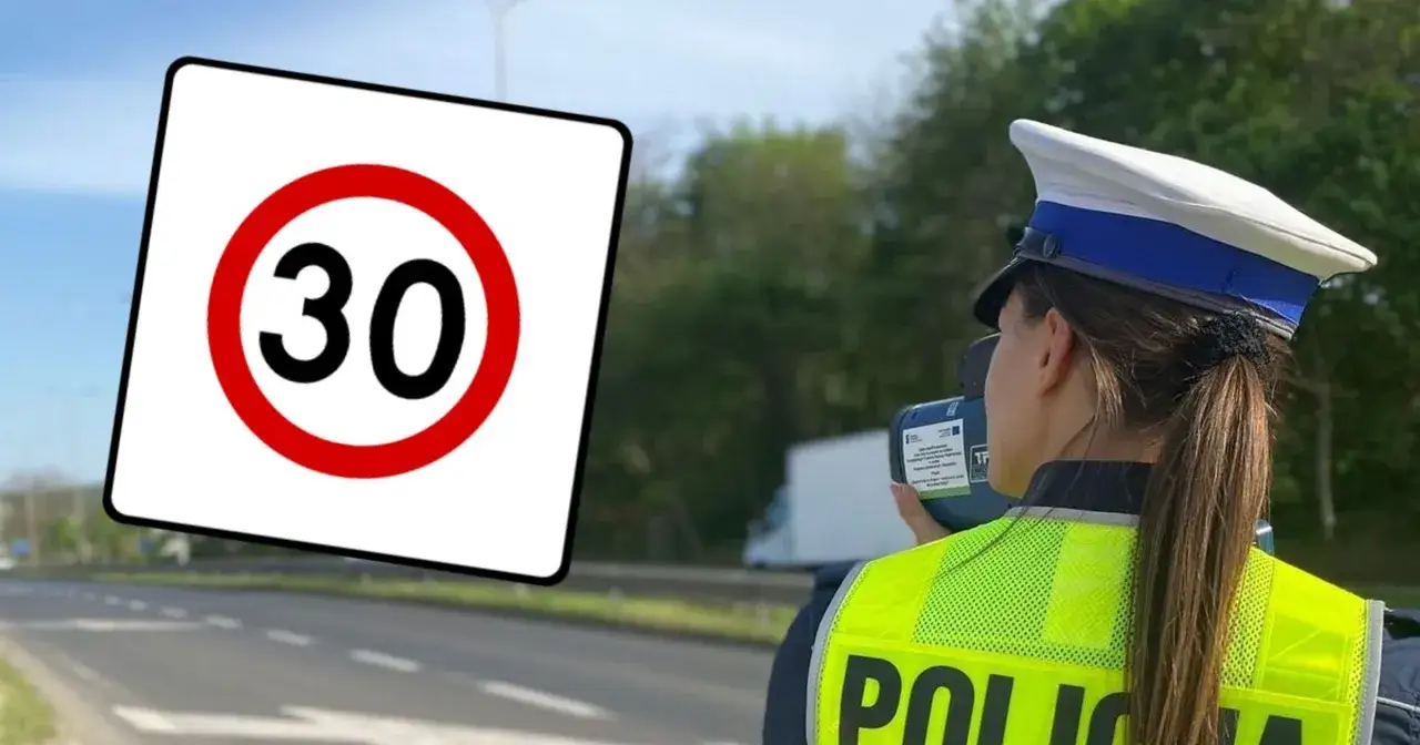 Znak ograniczenia prędkości do 30 km/h. Policjantka mierzy prędkość pojazdów.